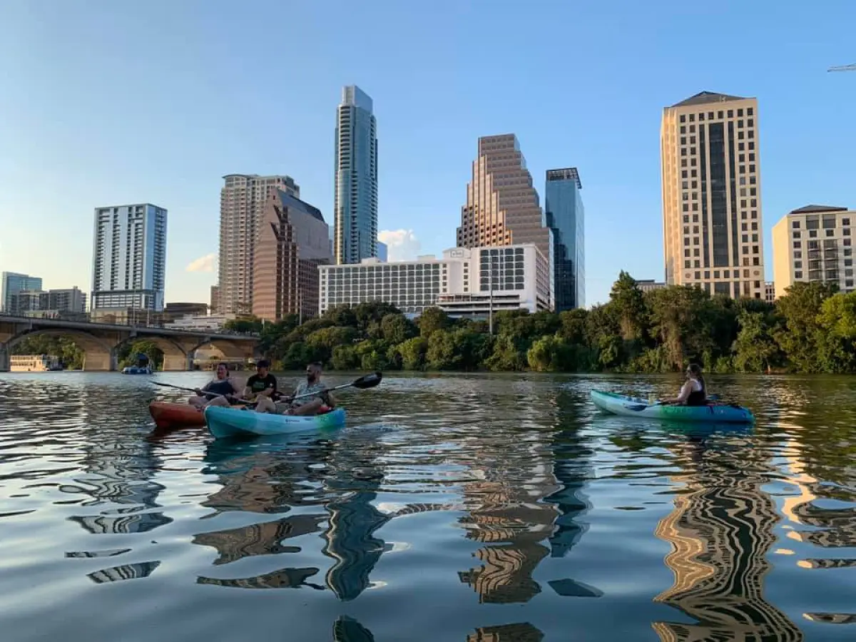 a body of water with a city in the background