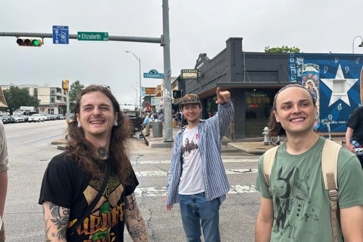 a couple of people that are standing in the street