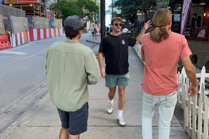 a group of people walking down a street